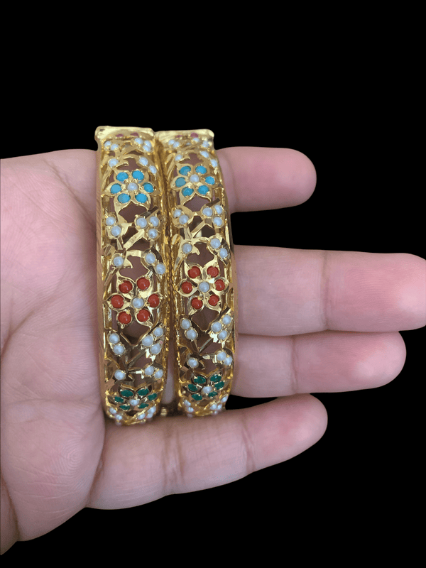 A close-up shot of our Jandau Bangles being held
