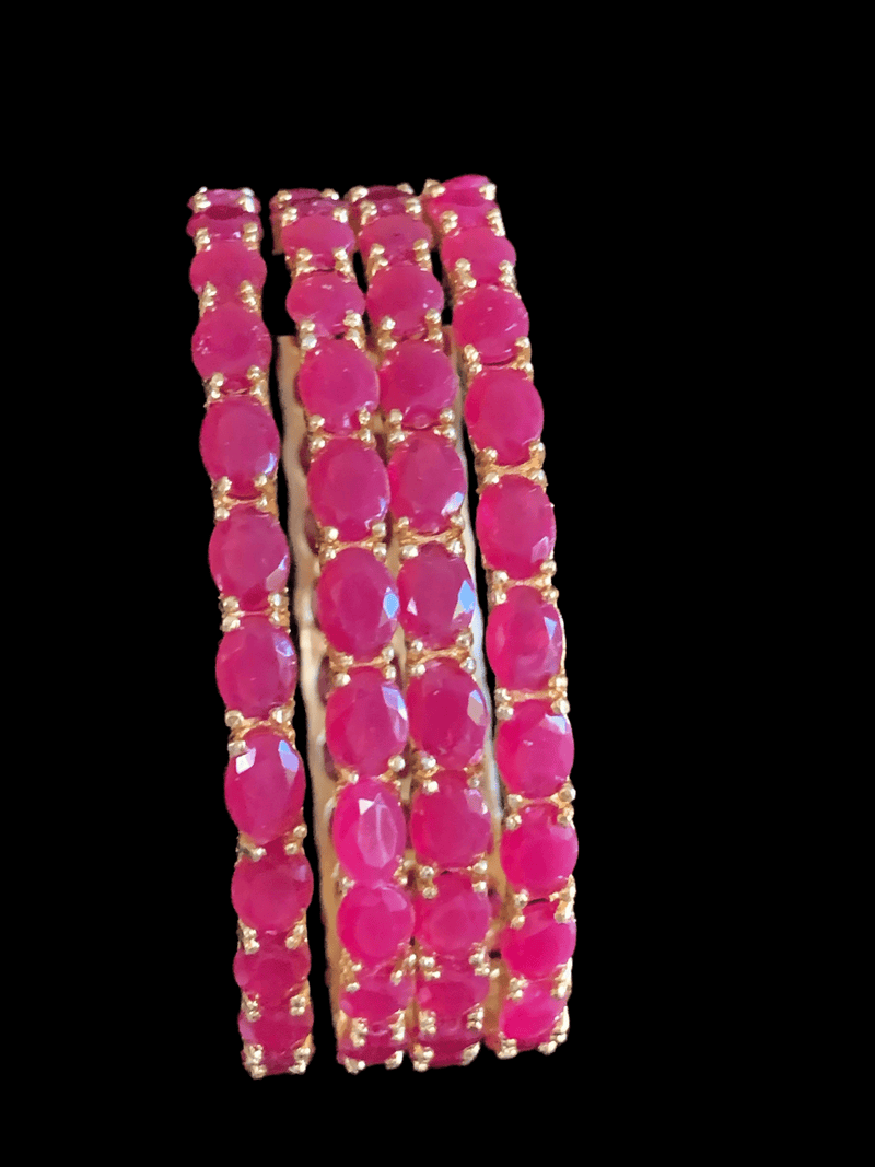 Front view of the set of bracelets viewing pink stones placed in 22 carat gold. 