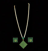 Nandini  green  long pendant set with earrings in  fresh water pearls (READY TO SHIP )